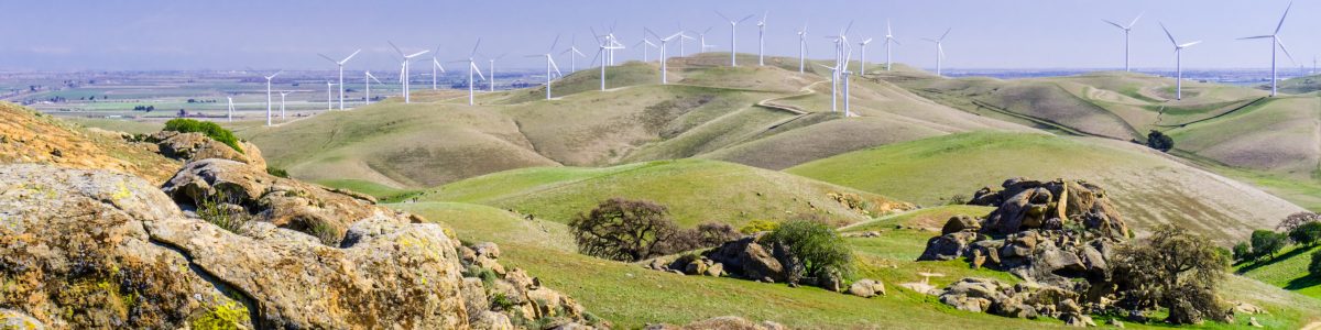 Rock formations on the hills of Costa Contra county; wind turbin Rock formations on the hills of Costa Contra county; wind turbines in the background, east San Francisco bay area, California